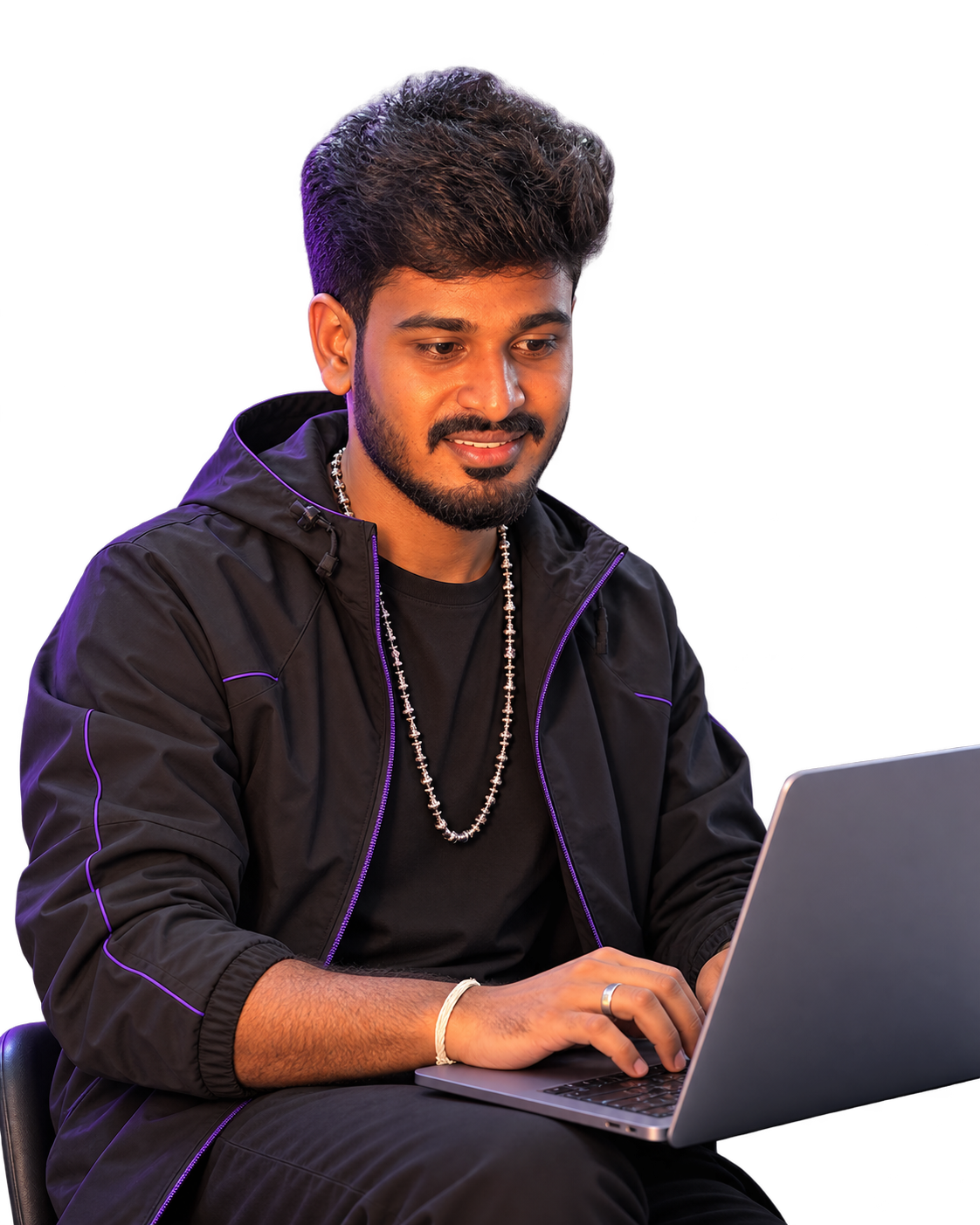 Character in black techwear seated and typing on a laptop